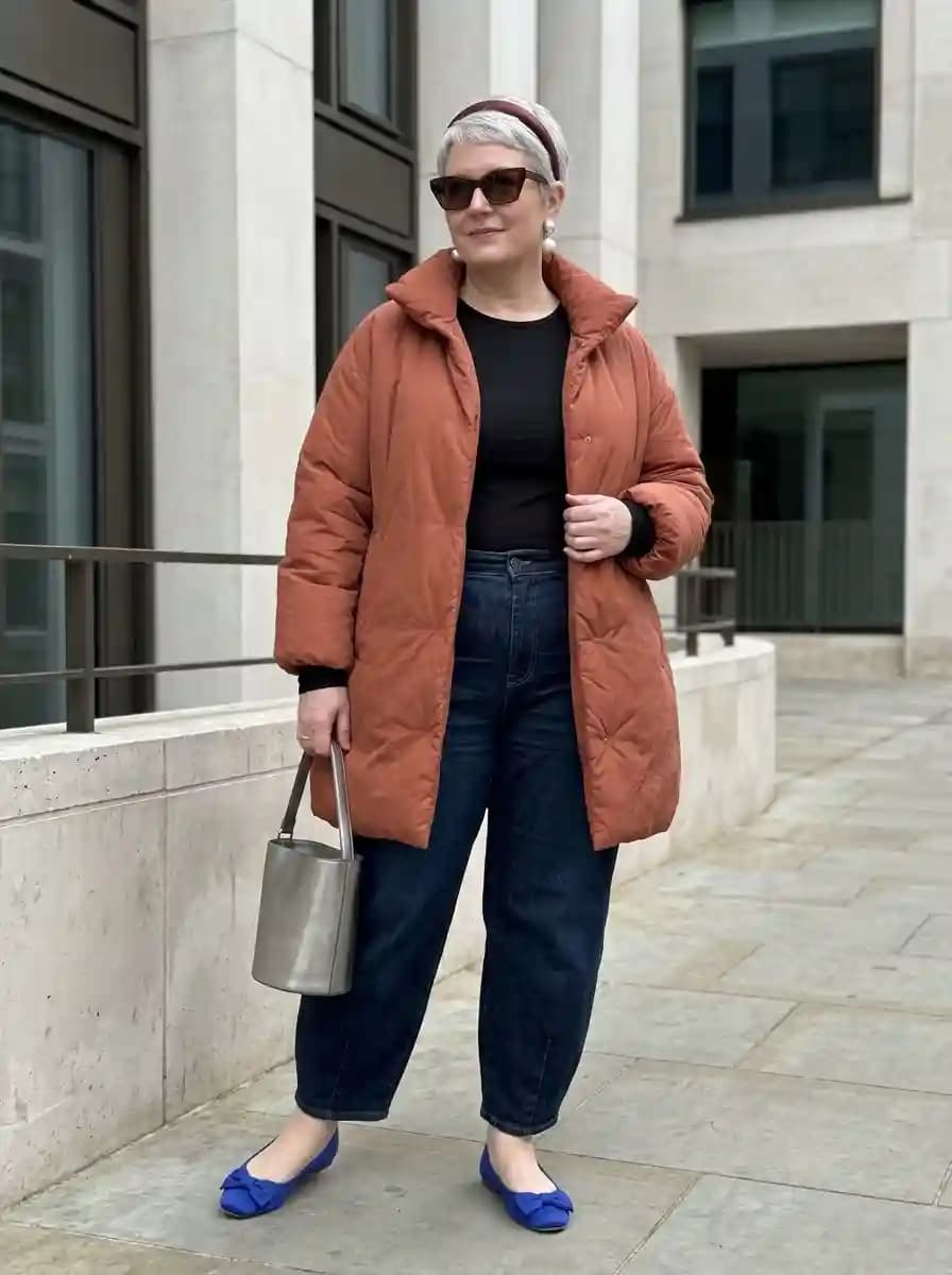Black Top + Dark Wash Jeans + Rust Puffer Coat