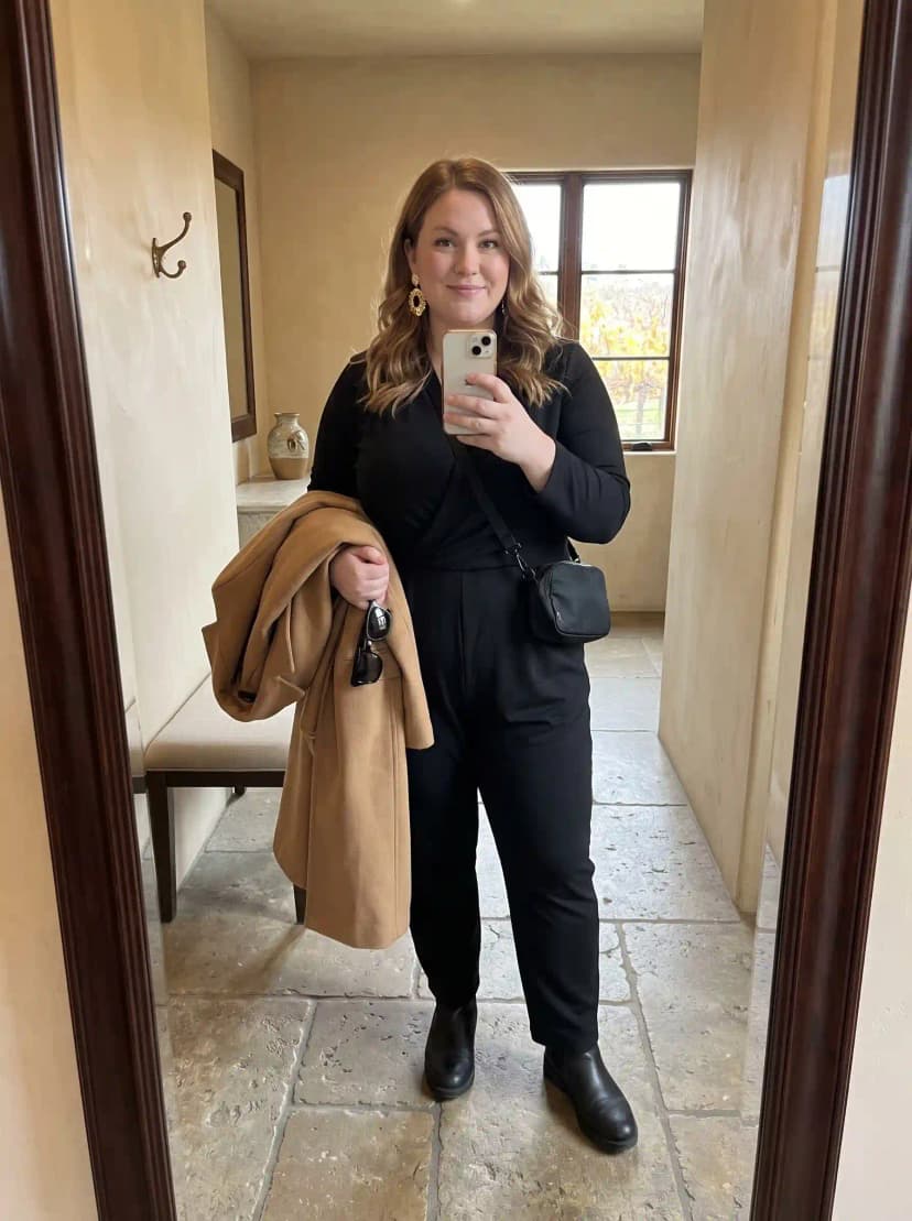 Black Wrap Jumpsuit + Camel Coat + Black Ankle Boots