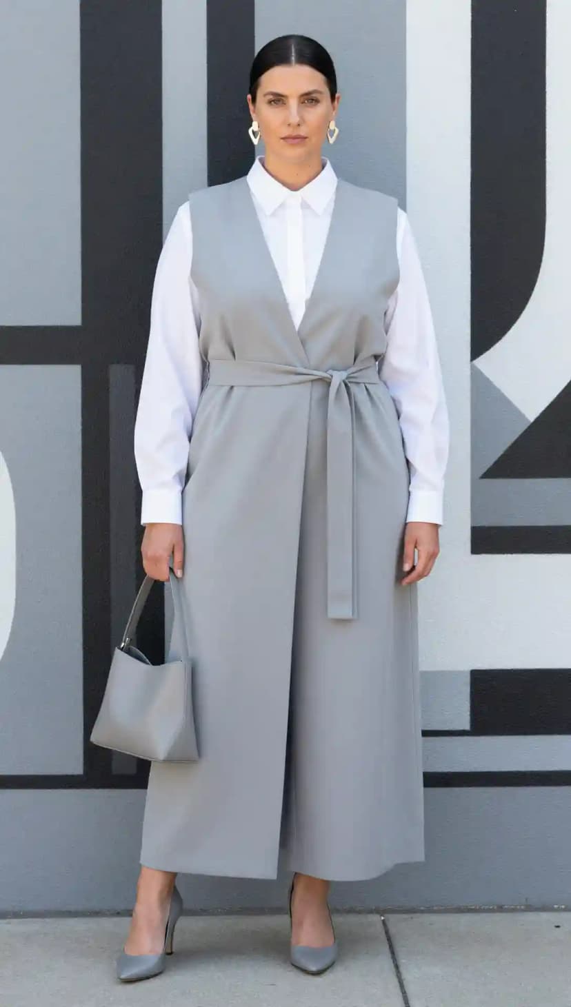 White Button-Down Shirt + Grey Sleeveless Jumpsuit + Grey Heels + Grey Handbag