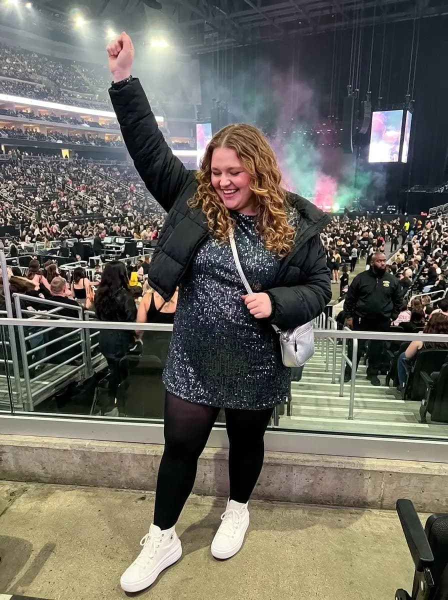 Sparkly Sequin Mini Dress with Black Puffer Jacket and White Sneakers
